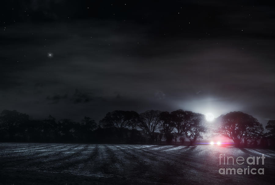 Lone driver in a dark field Photograph by Simon Bratt