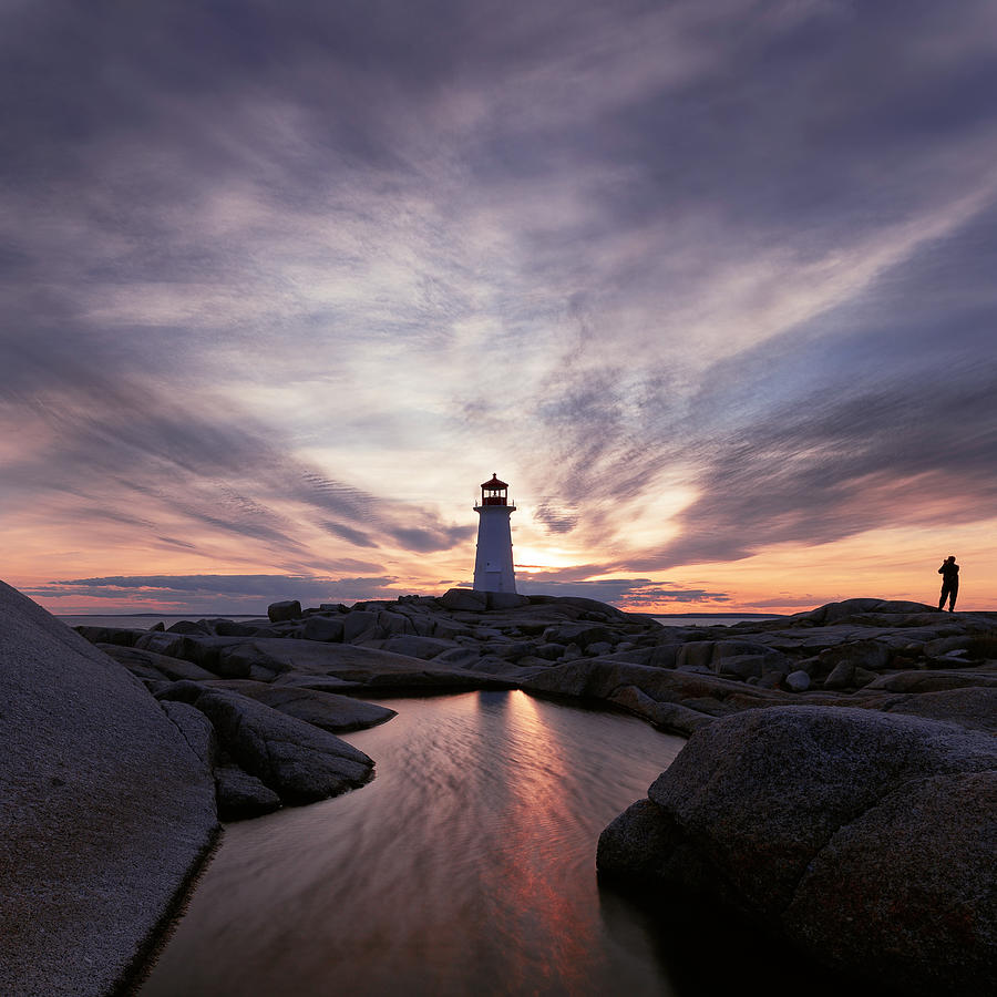 Lone photographer enjoying an isolated Peggys Cove sunset Photograph by Murray Rudd