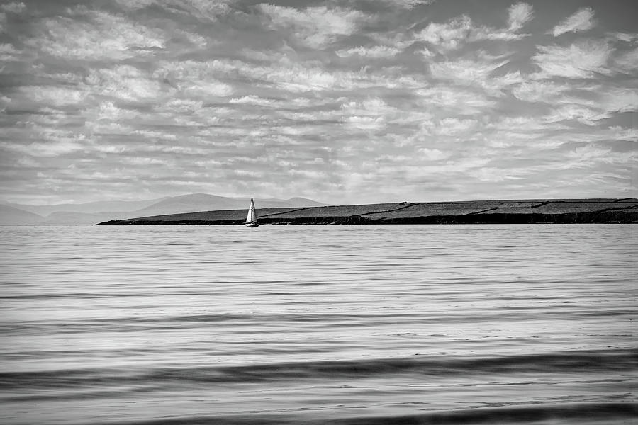 Lone White Sailboat in Ireland in Black and White Photograph by Debra and Dave Vanderlaan