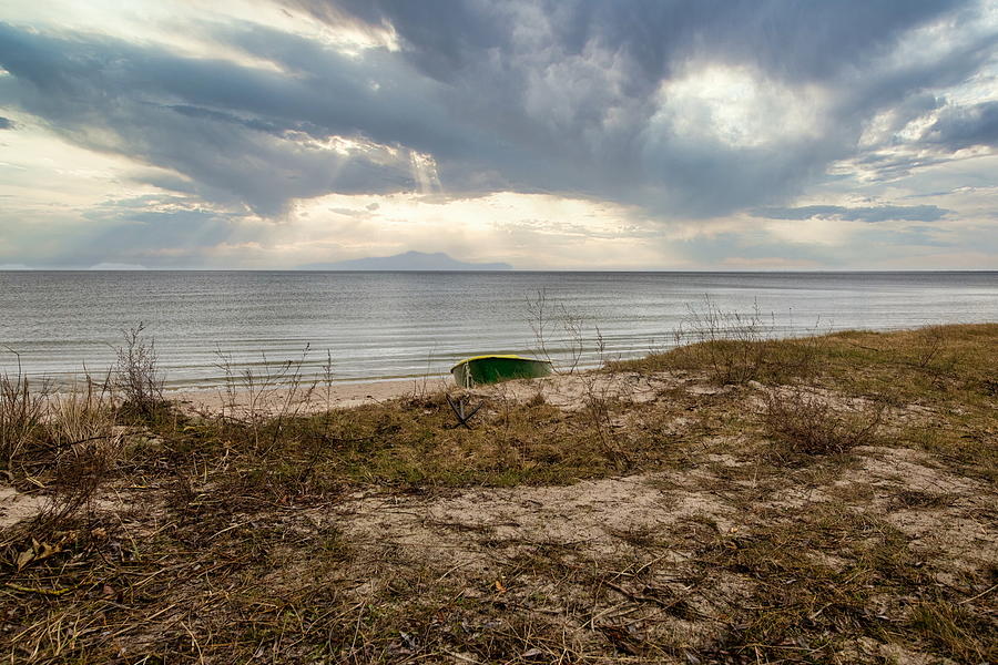 Lonely Boat on the Beach  Photograph by Aleksandrs Drozdovs
