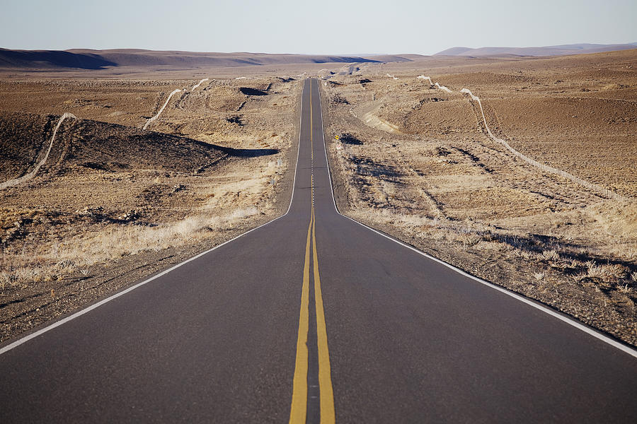 Long straight road Photograph by Russell Monk
