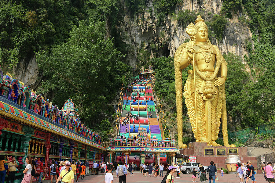 Lord Murugan with prayer wheels and stairs at Batu Caves Photograph by ...