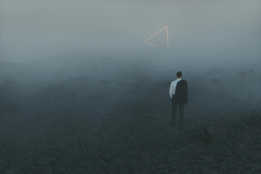 Lost businessman in mystery landscape Photograph by Gremlin