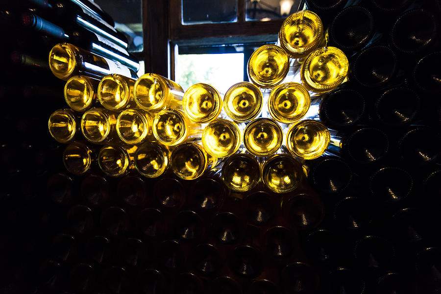 Lots of wine bottles in a wine-cellar Photograph by Anton Petrus
