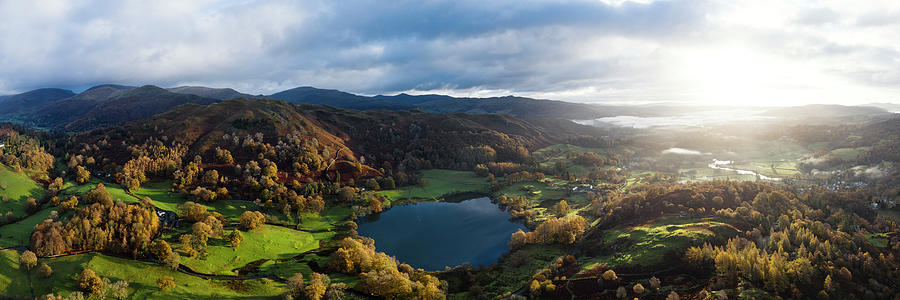 Loughrigg Tarn in autumn in the Lake District Photograph by Sonny Ryse