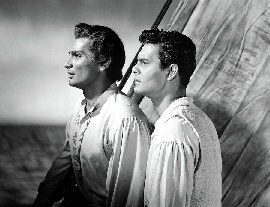 LOUIS JOURDAN and JEFF CHANDLER in BIRD OF PARADISE -1951-, directed by DELMER DAVES. Photograph by Album