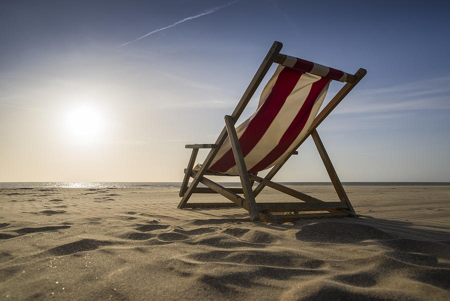 Lounge Chair on sunny day at beach Photograph by Ae-photos