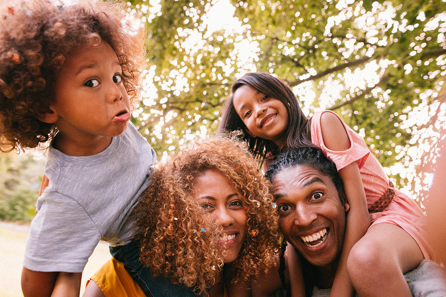 Lovely African-american family laughing and making silly faces Photograph by Wundervisuals