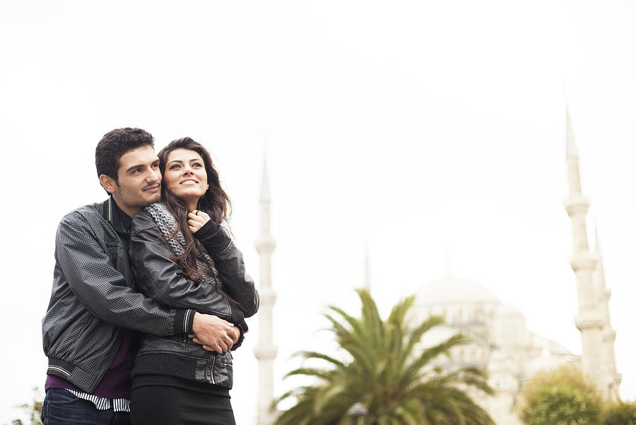 Lovely Young Turkish Couple In Front Of The Blue Mosque Photograph by Visualspace