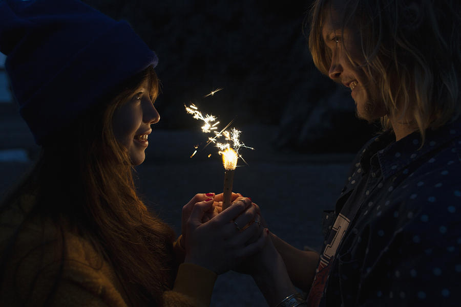 Lovers Holding A Firework Together At Night Photograph by Justin Case