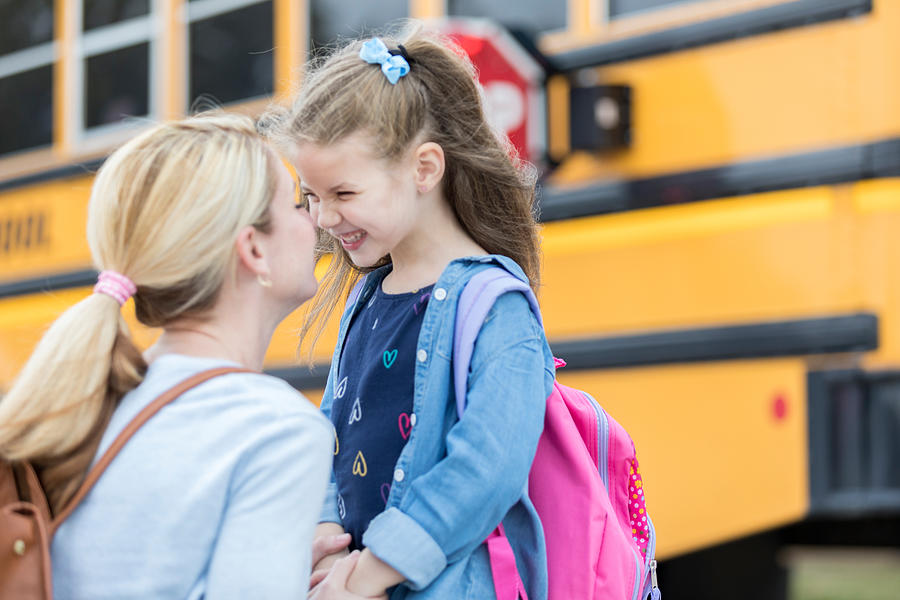 Loving mom sends adorable daughter off to school Photograph by SDI Productions