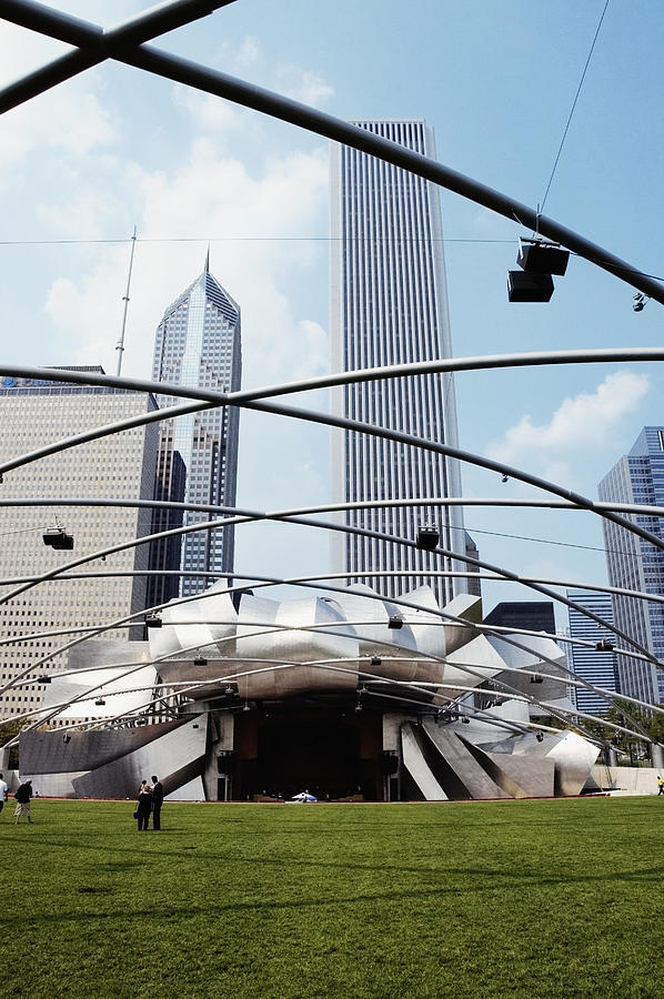 Low angle view of a group of people standing on the lawn, Jay Pritzker Pavilion, Chicago, Illinois, USA Photograph by Glowimages