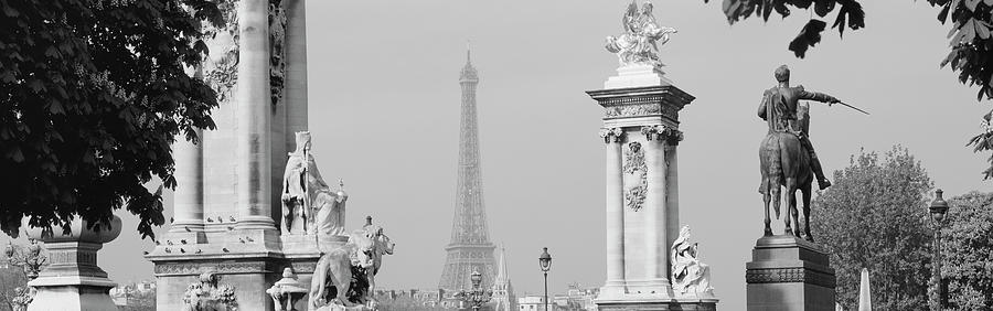 Low angle view of a statue, Alexandre III Bridge, Eiffel Tower, Paris, France Photograph by Panoramic Images