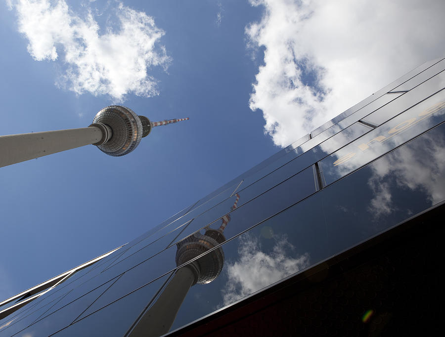 Low Angle View Of Fernsehturm Against Modern Building Photograph by Paulien Tabak / EyeEm