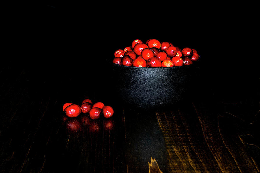 Low Key Cranberries in Black Bowl on Brown Base Photograph by Charles Floyd