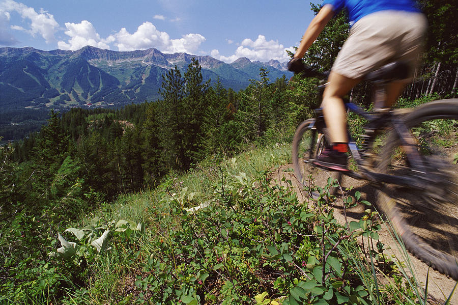 Low Section Shot of a Cyclist Riding a Mountain Bike in a Scenic Landscape Photograph by Darryl Leniuk