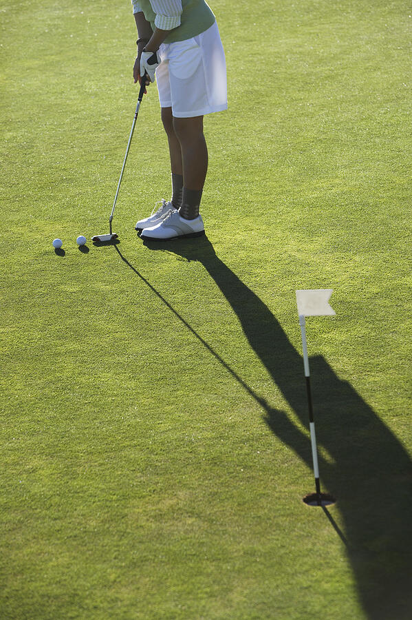Low Section View of a Woman Playing Golf Photograph by John Cumming