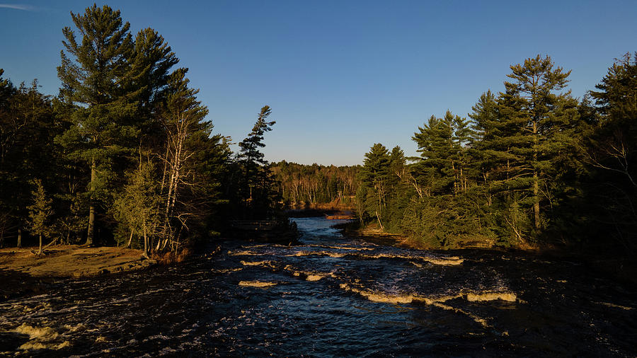 Low view of Tahquamenon Falls at sunset Photograph by Eldon McGraw