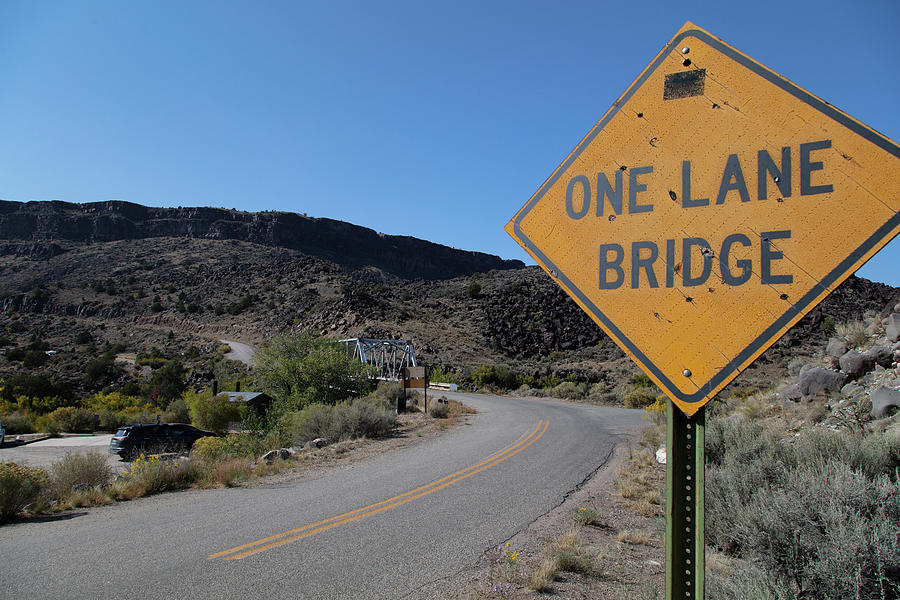 Lower Taos Canyon in New Mexico One Lane Bridge sign Photograph by Eldon McGraw