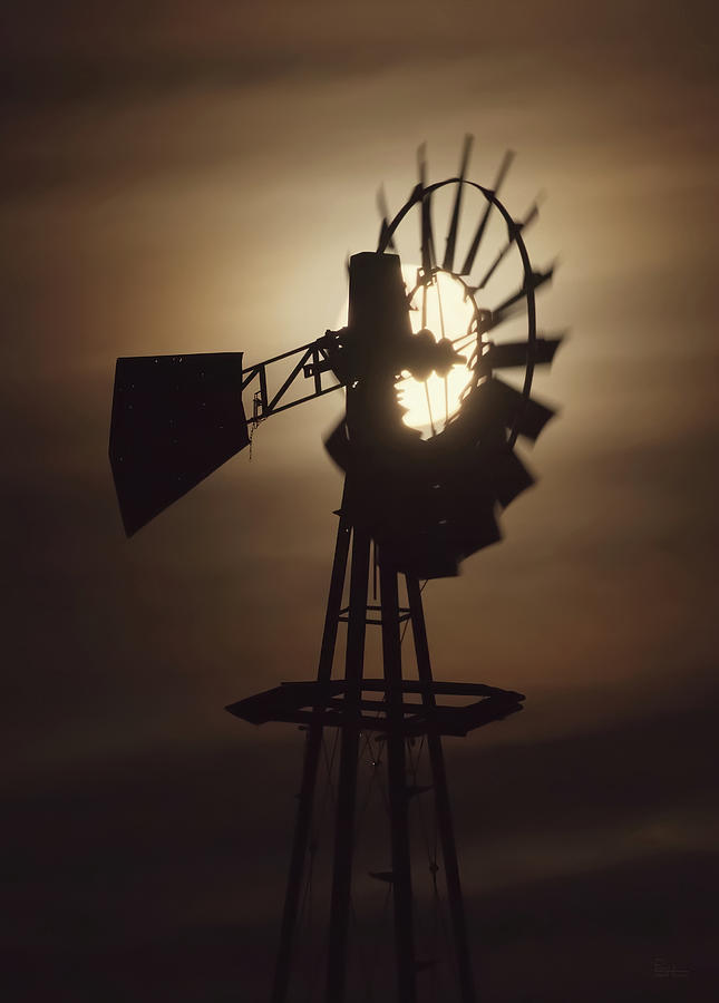 Lunar Power - full moon behind a still-turning abandoned ND windmill Photograph by Peter Herman