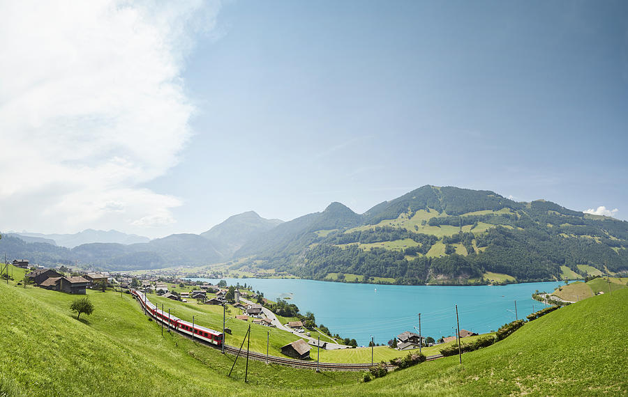 Lush Swiss landscape with commuter train and lake, Lungern, Obwalden, Switzerland Photograph by James ONeil