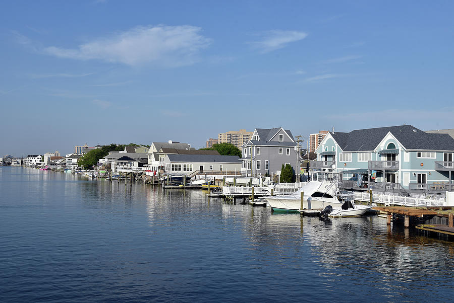 Luxury homes line a New England waterway Photograph by Mark Stout