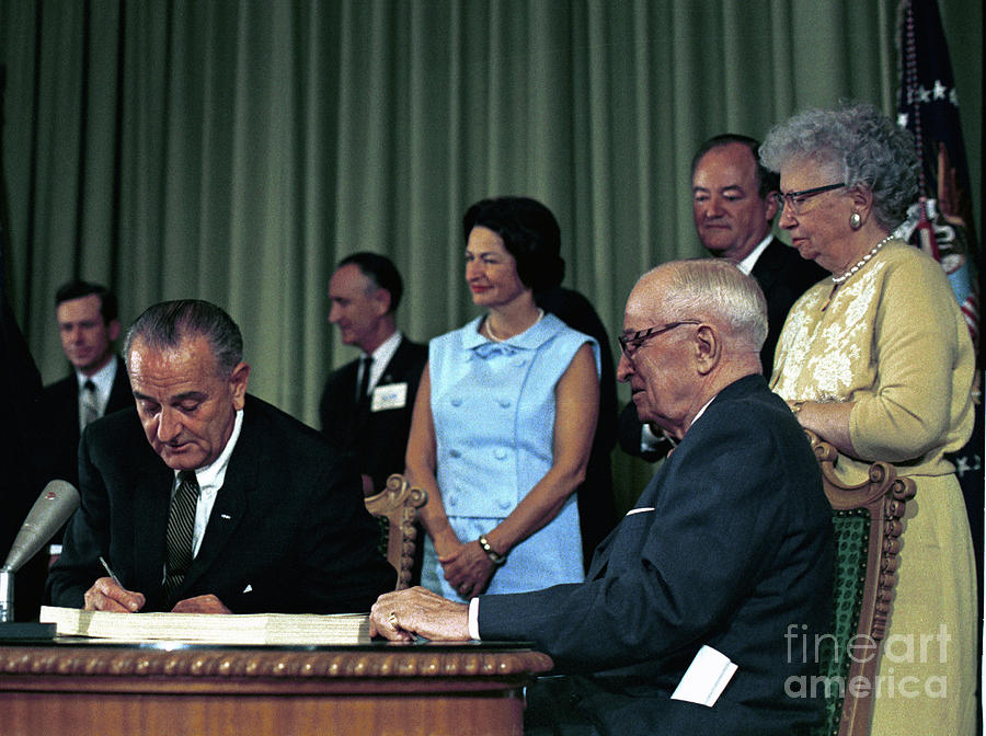 Lyndon Baines Johnson Signing The Medicare Bill, 1965 Photograph By ...