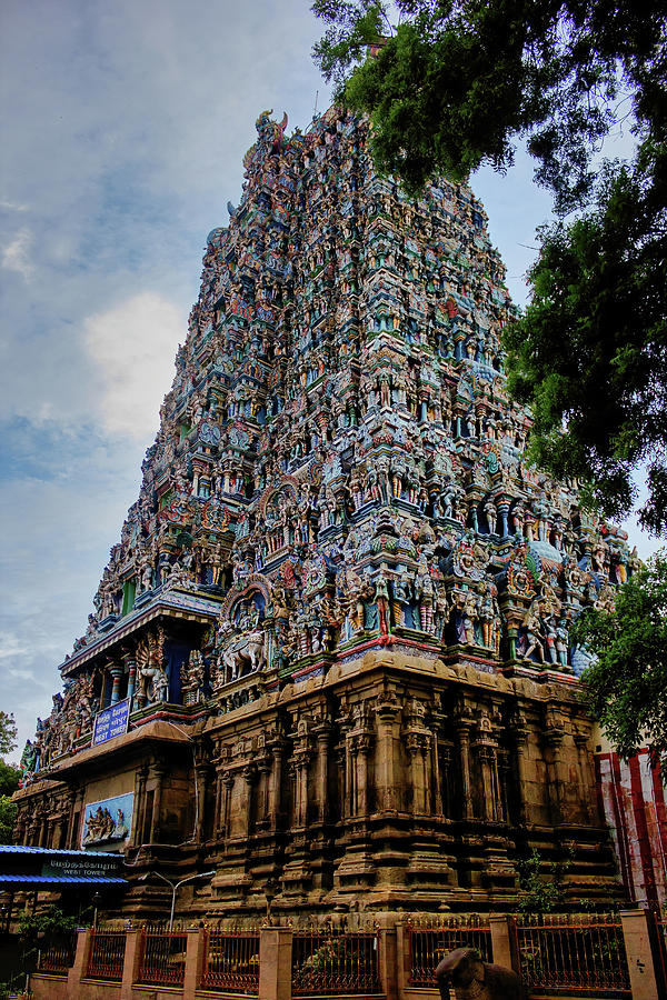 Architecture Photograph - Madurai, South India - One of the hindu religious temple amongst many in Meenakshi temple against blue sky by Arpan Bhatia