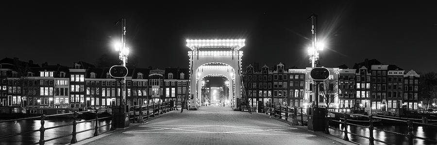 Magere Brug bridge at night Amstel River Amsterdam Netherlands Photograph by Sonny Ryse