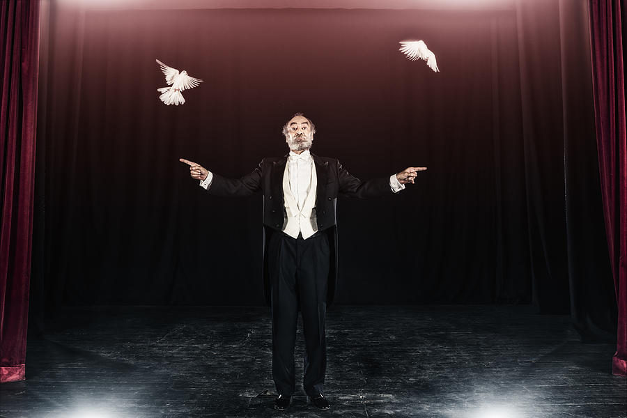 Magician trick with white doves Photograph by Aluxum