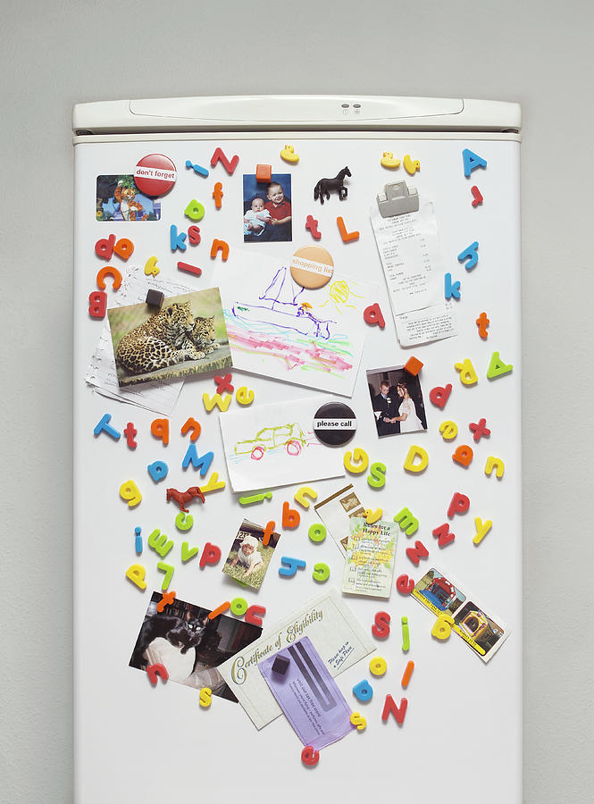 Magnets, Paintings and Photographs on a Fridge Door Photograph by Jonathan Kitchen