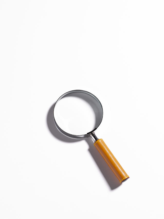 Magnifier on white background with copy space  Photograph by Peter Dazeley