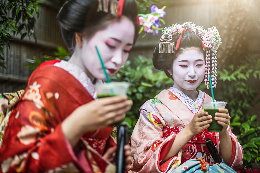 Maikos having green tea in Gion Photograph by Xavierarnau