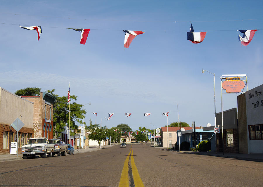Main street in small town Photograph by Alistair Baker