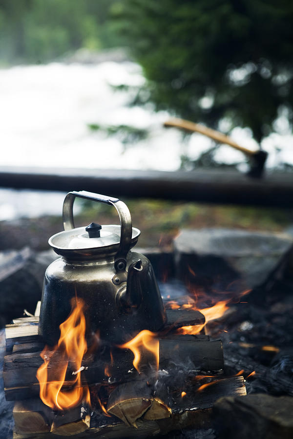 Making coffee over a camp fire Sweden. Photograph by Plattform