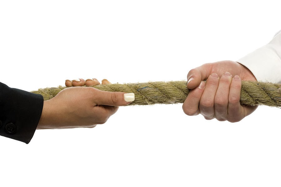 Male and female hands grasping rope. Tug-O-War. Photograph by Drewhadley