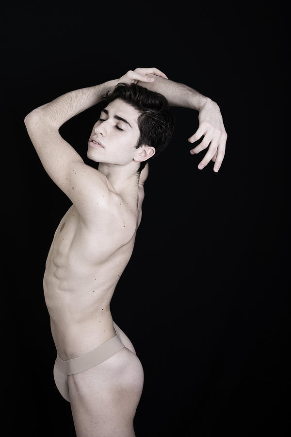 Male ballet dancer posing semi nude on black Photograph by By Wunderfool