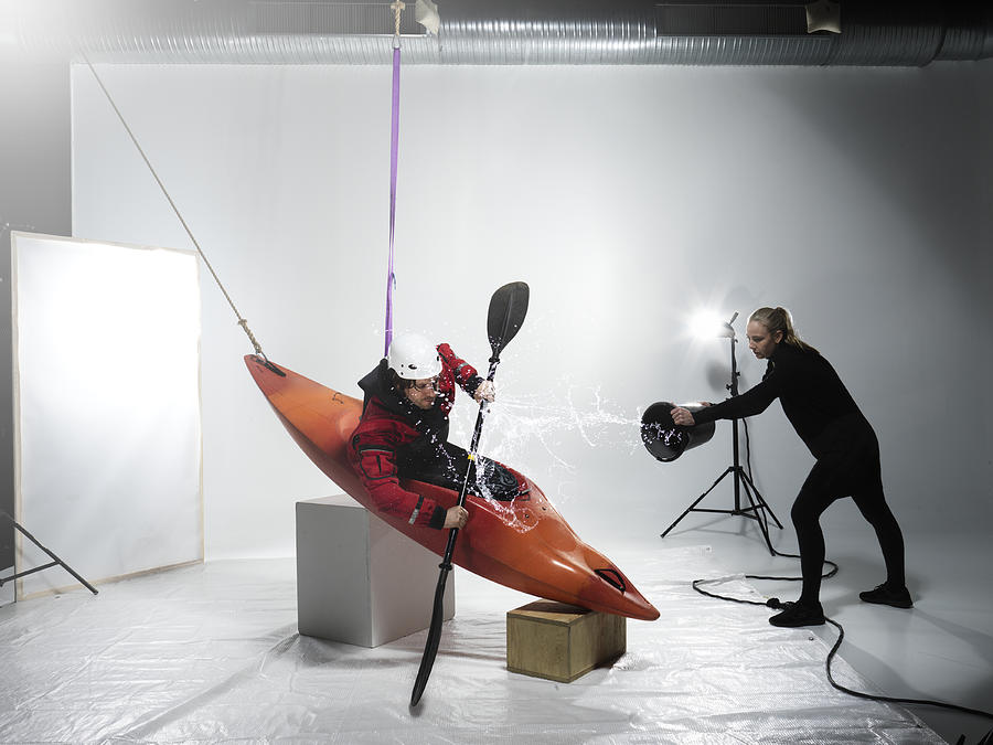 Male canoer being splashed in a studio Photograph by Henrik Sorensen