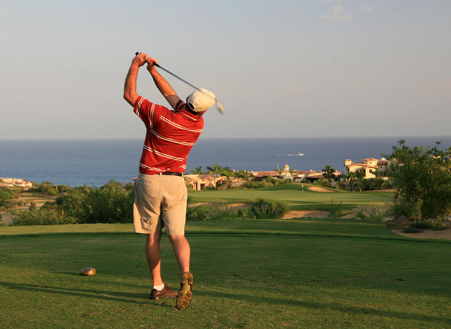 Male Caucasian Golfer Swinging in Mexico Photograph by ImagineGolf
