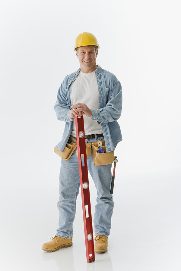 Male construction worker holding level Photograph by Jose Luis Pelaez Inc