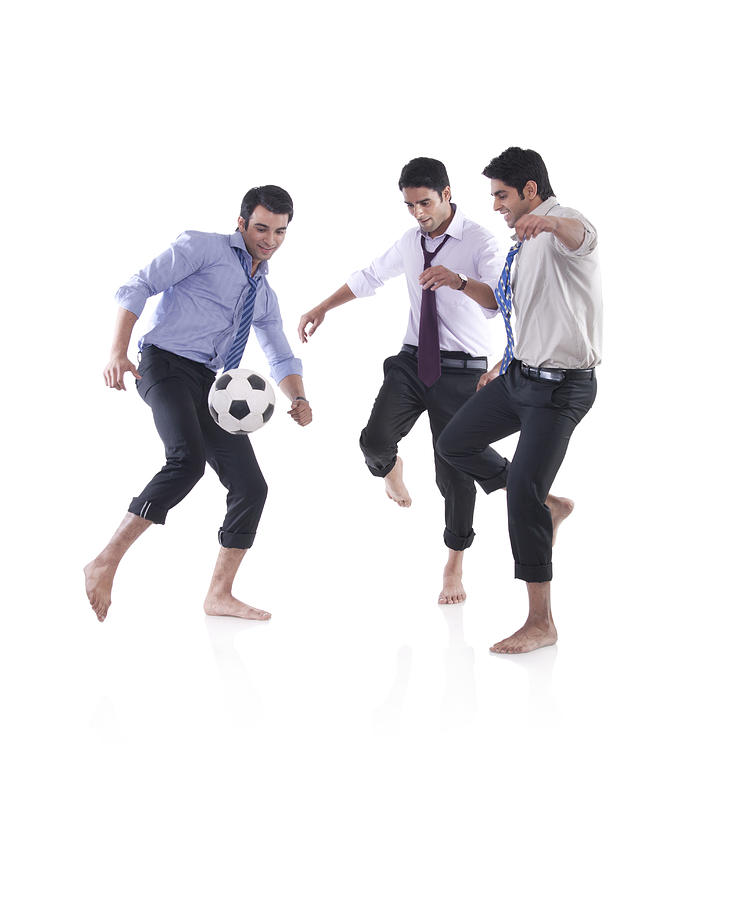 Male executives playing soccer Photograph by Sudipta Halder