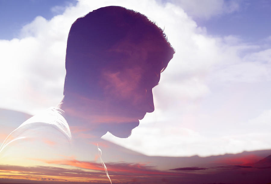 Male face silhouetted in sky Photograph by Tara Moore