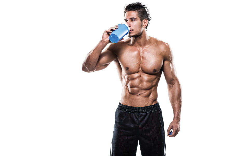 Male fitness athlete drinking protein shake Photograph by Extreme-photographer