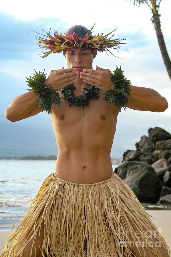 Male Hula Dancer in a kiss gesture with his hands.  Photograph by Gunther Allen