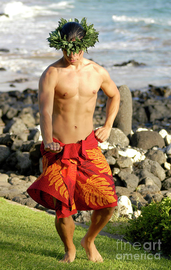 Male hula dancer performs at the shoreline  Photograph by Gunther Allen