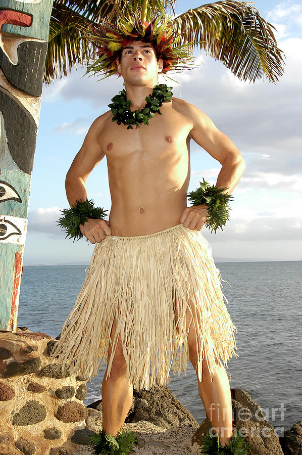 Male Hula dancer standing tall in front of a beautiful ocean view. Photograph by Gunther Allen