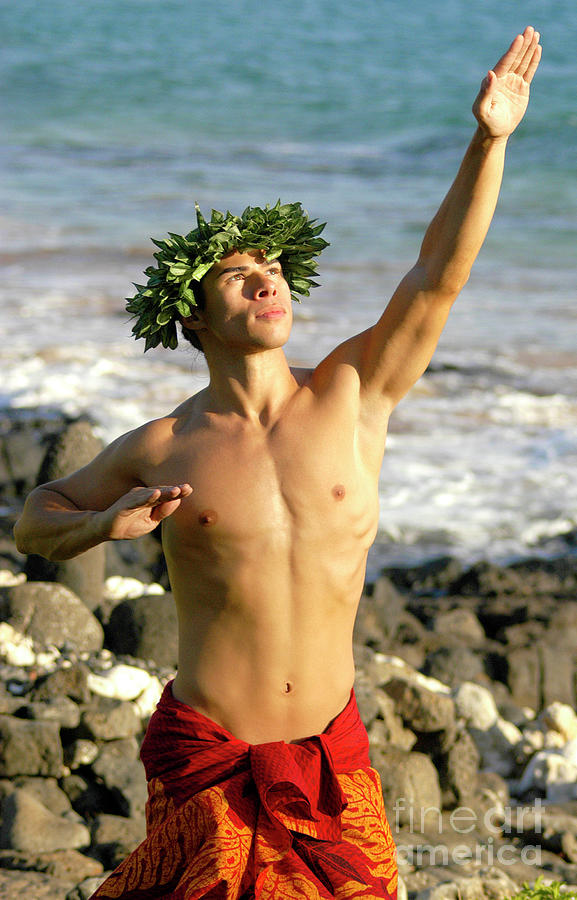 Male hula dancer with the ocean behind him is a photograph by Gunther Allen...