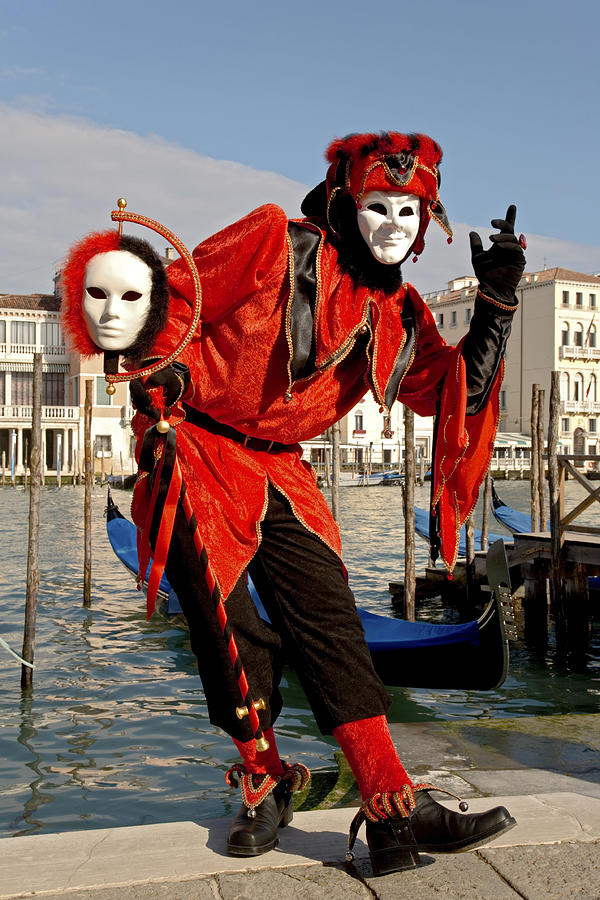 Male mask with red harlequin costume at carnival in Venice Photograph by RelaxFoto.de
