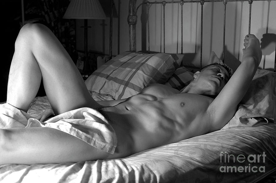 Male nude in bed sleeping and dreaming Photograph by Gunther Allen