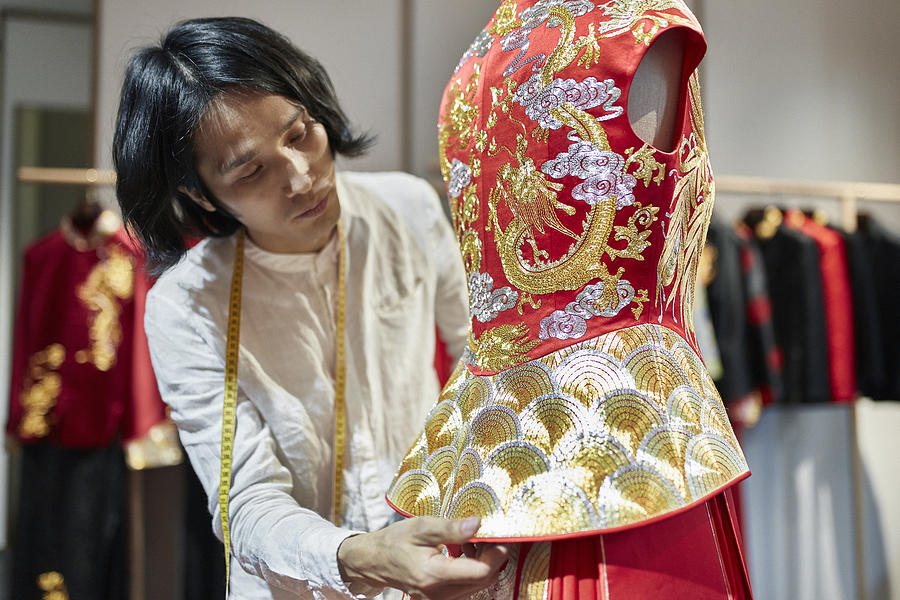 Male Qun Gua Designer Examining Peplum on Dressmaker’s Model Photograph by Xavierarnau